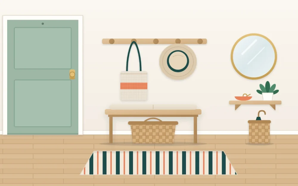 Narrow entry wall beside a front door with a peg rail holding a tote and a hat, a round mirror, a slim shelf with a key dish, a small bench and a striped runner